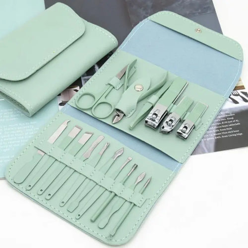 Mint green manicure set with tools in a case on a white background