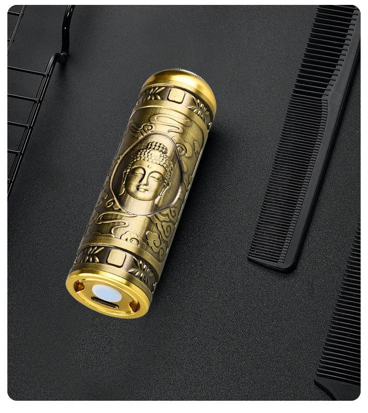 Gold cylindrical object with intricate designs on a black surface