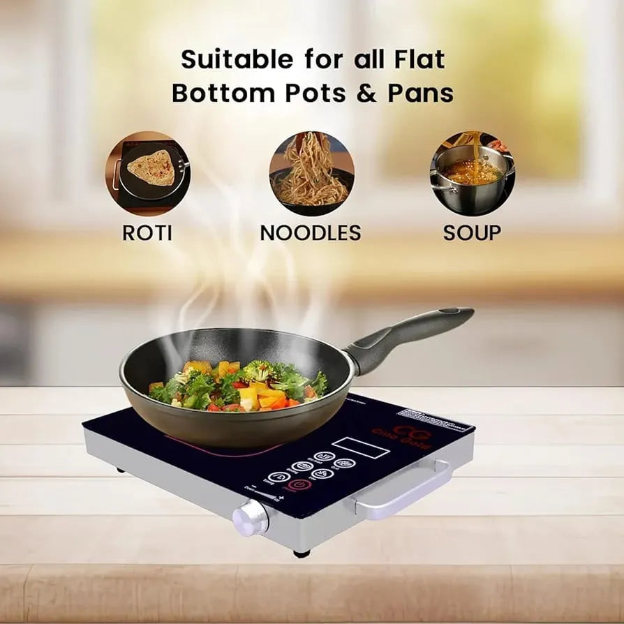 Induction cooktop with a frying pan containing vegetables, suitable for flat-bottom pots and pans.