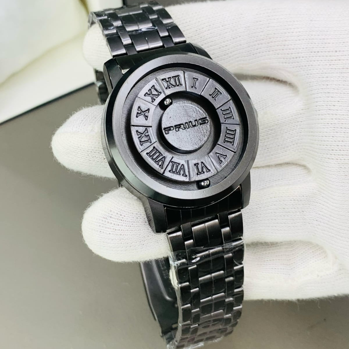 Silver watch with Roman numeral design on a white background
