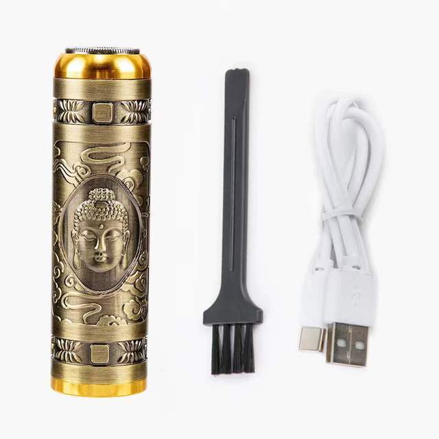 Bronze-colored vape pen with Buddha design, cleaning brush, and USB cable on a white background
