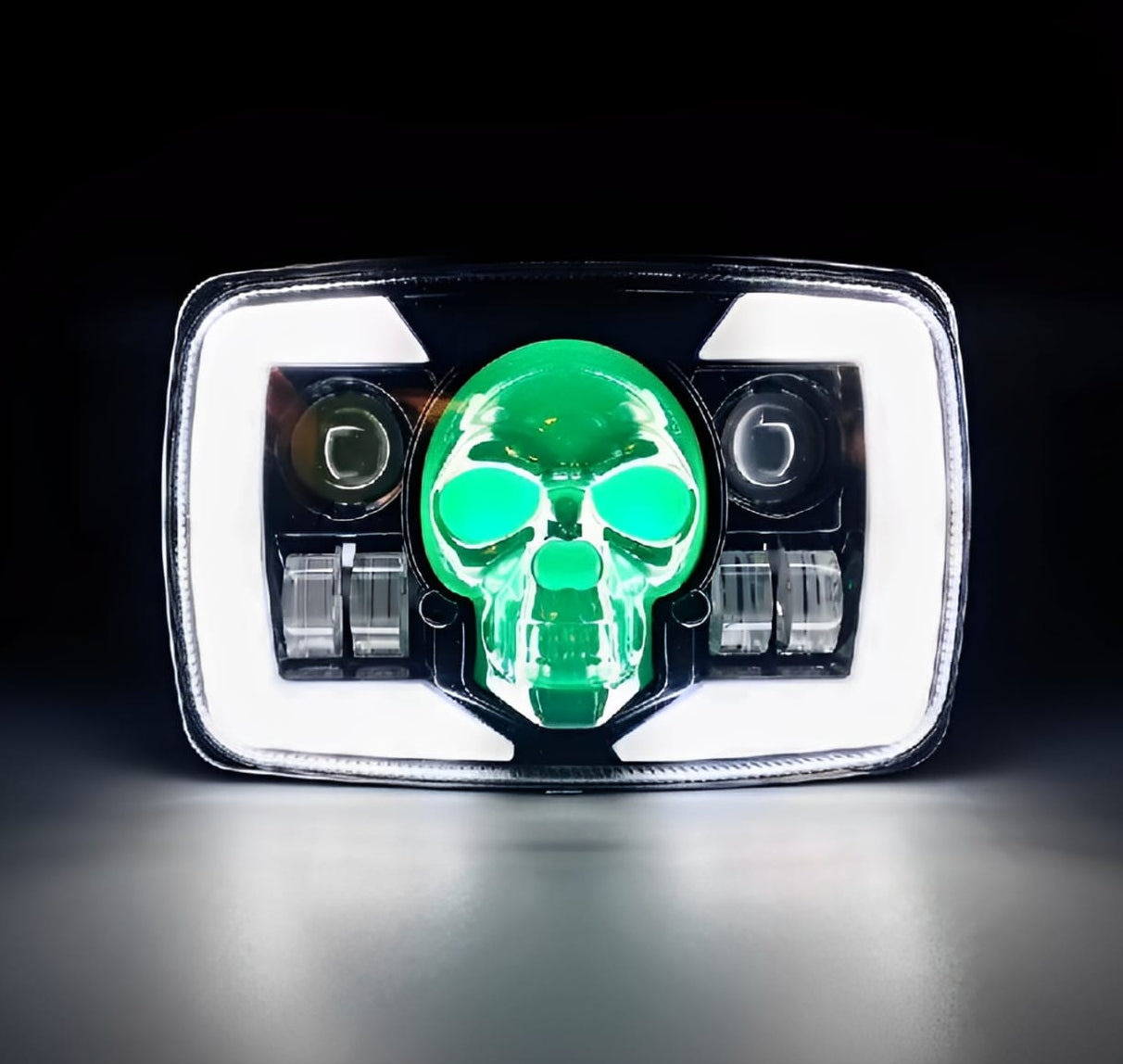 Car headlight with green skull design on a black background