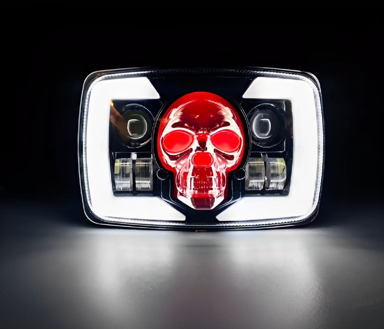 Car taillight with red skull design on a black background