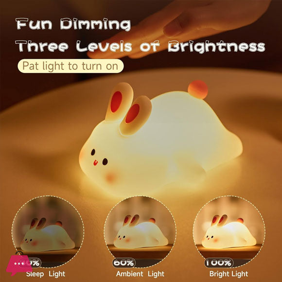 Cute rabbit-shaped night light with dimming options on a brown background
