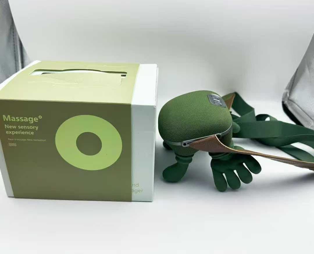 Green massage device with packaging on a white background