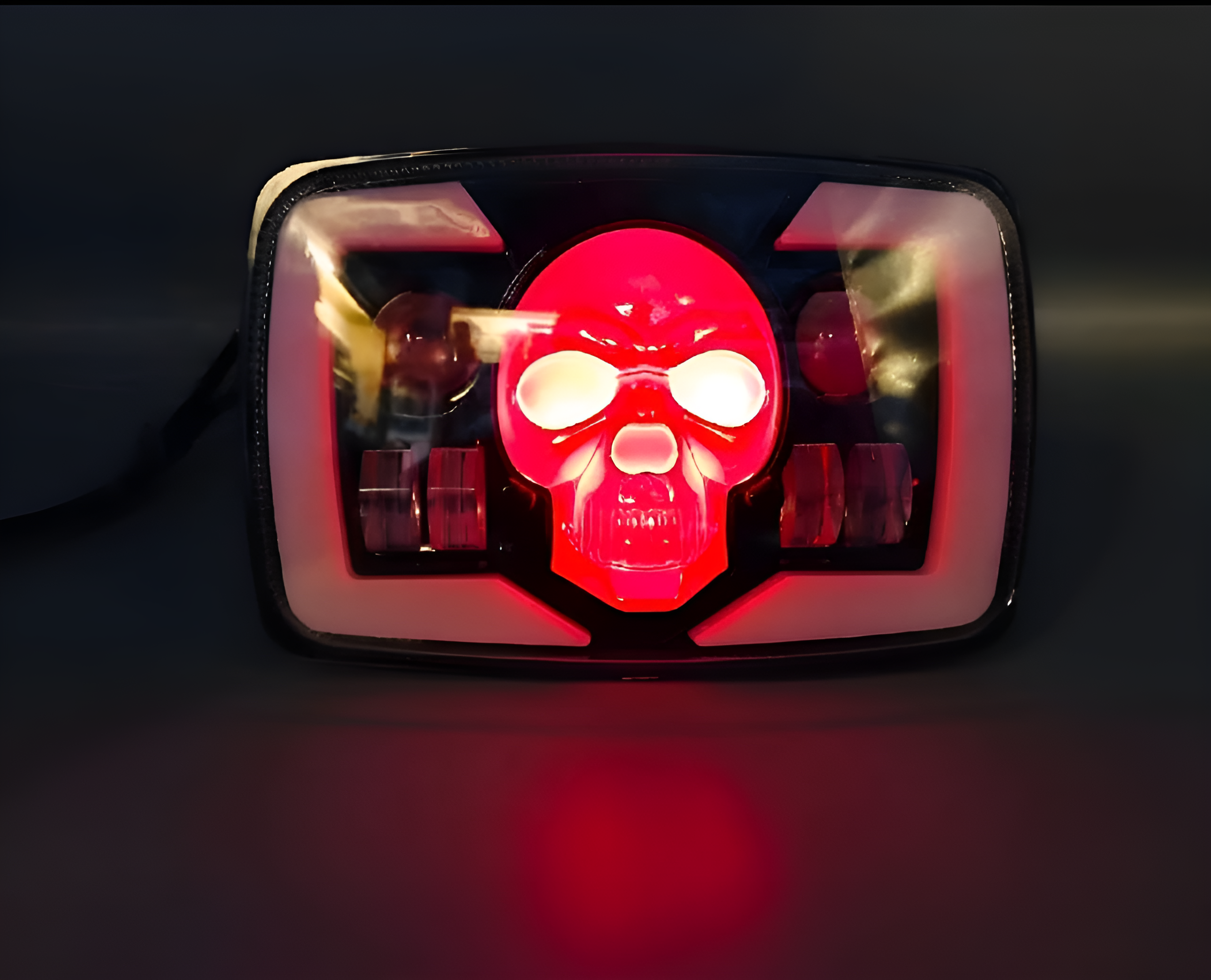 LED light with skull design on a dark background