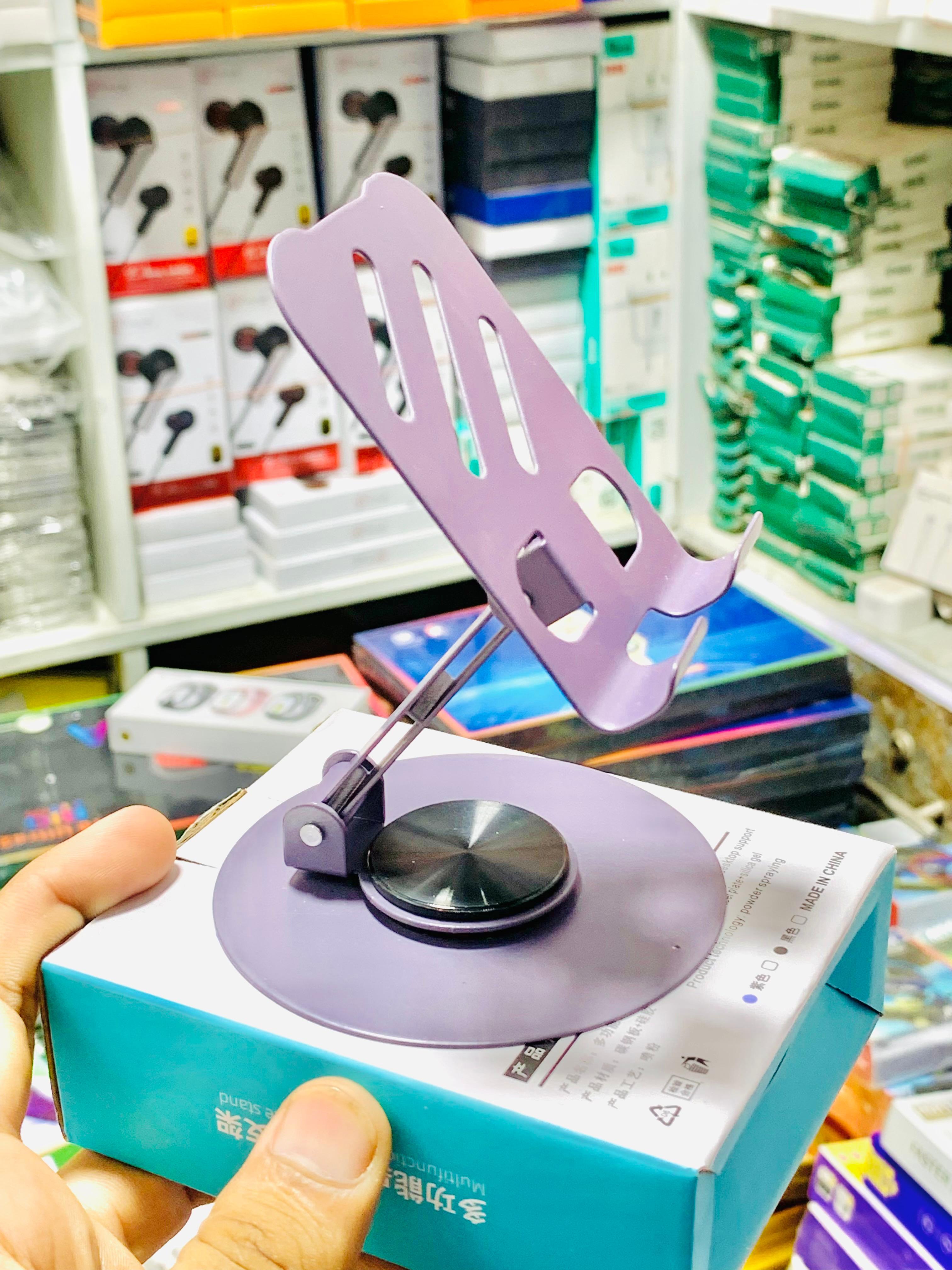 Purple phone holder on a box with a store shelf in the background