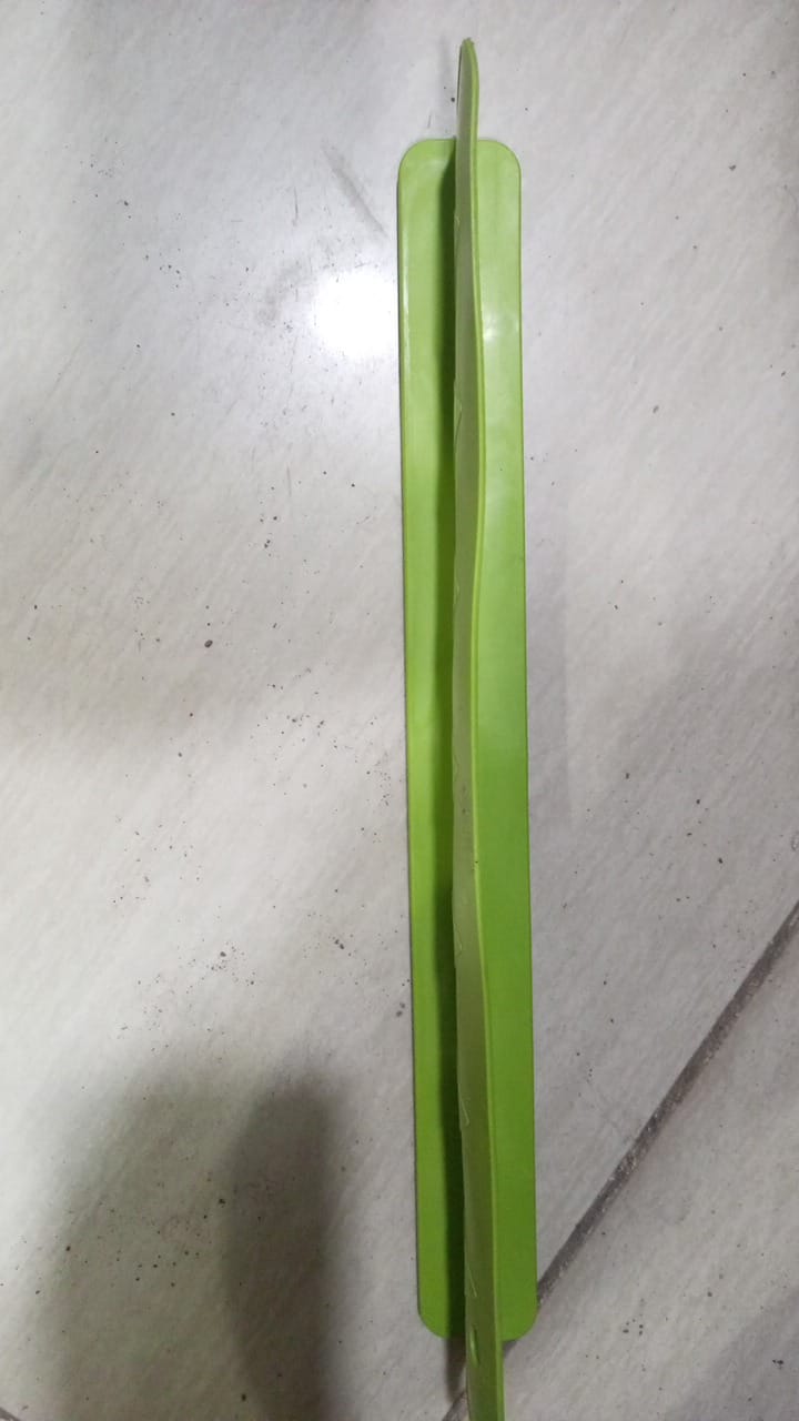 Green leaf on a white surface