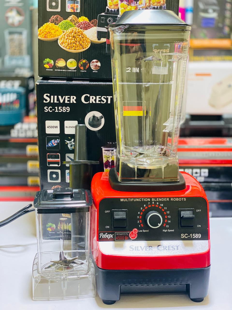 Silver Crest blender with a clear container on a blurred background