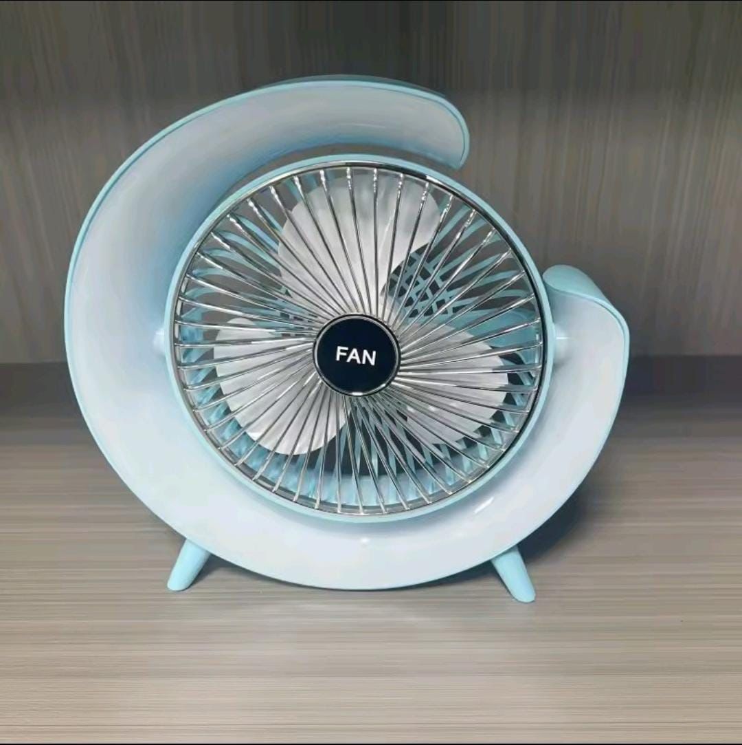 Small round fan with a blue casing on a wooden surface