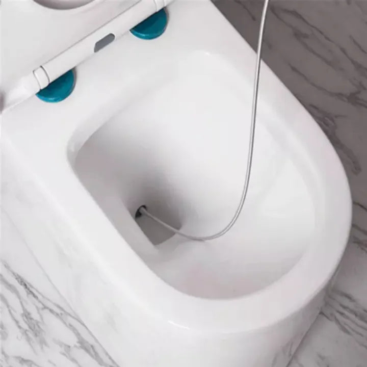 White bidet attachment on a toilet with blue nozzles against a marble bathroom background